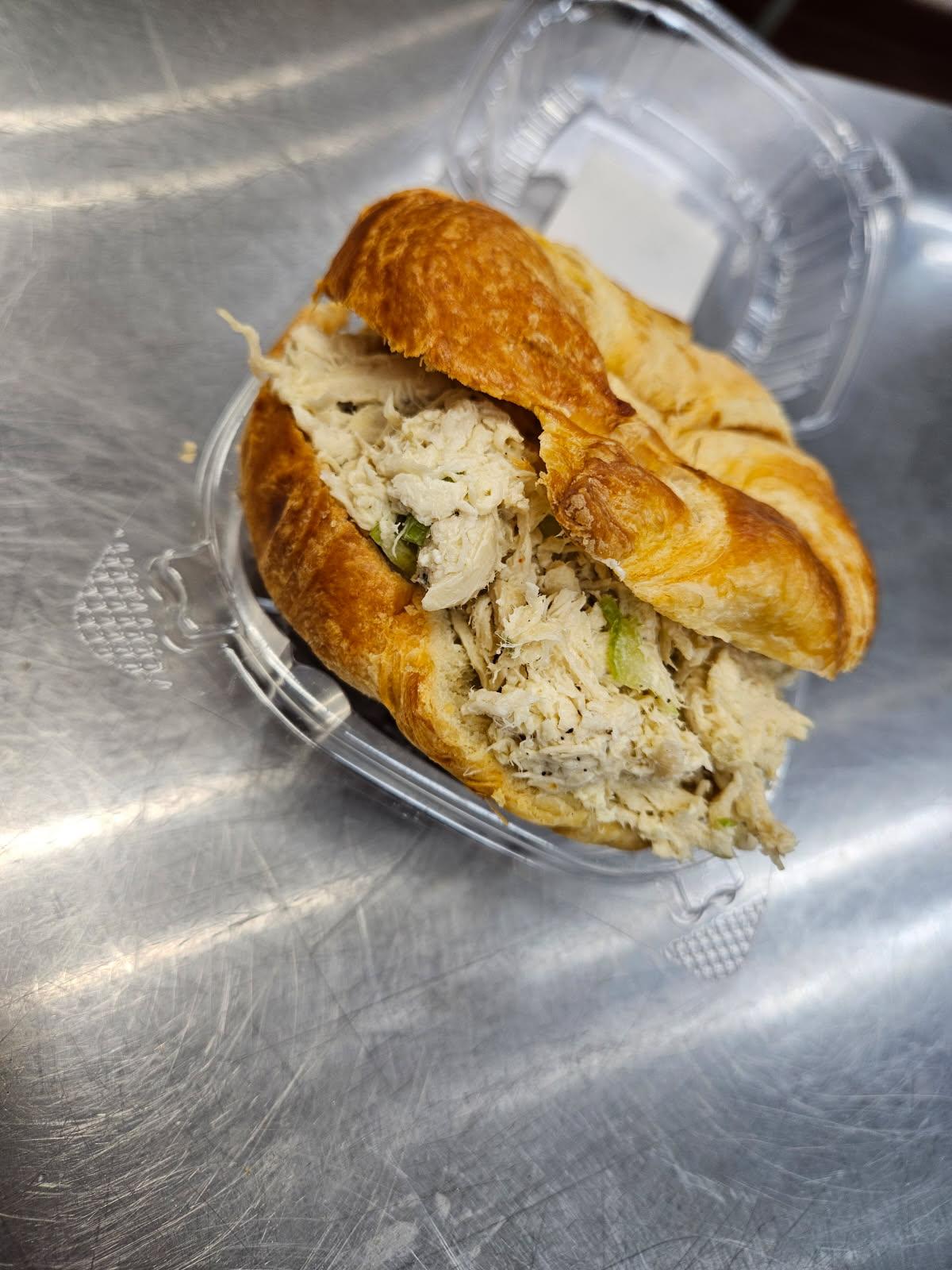 Chicken salad piled into a golden croissant